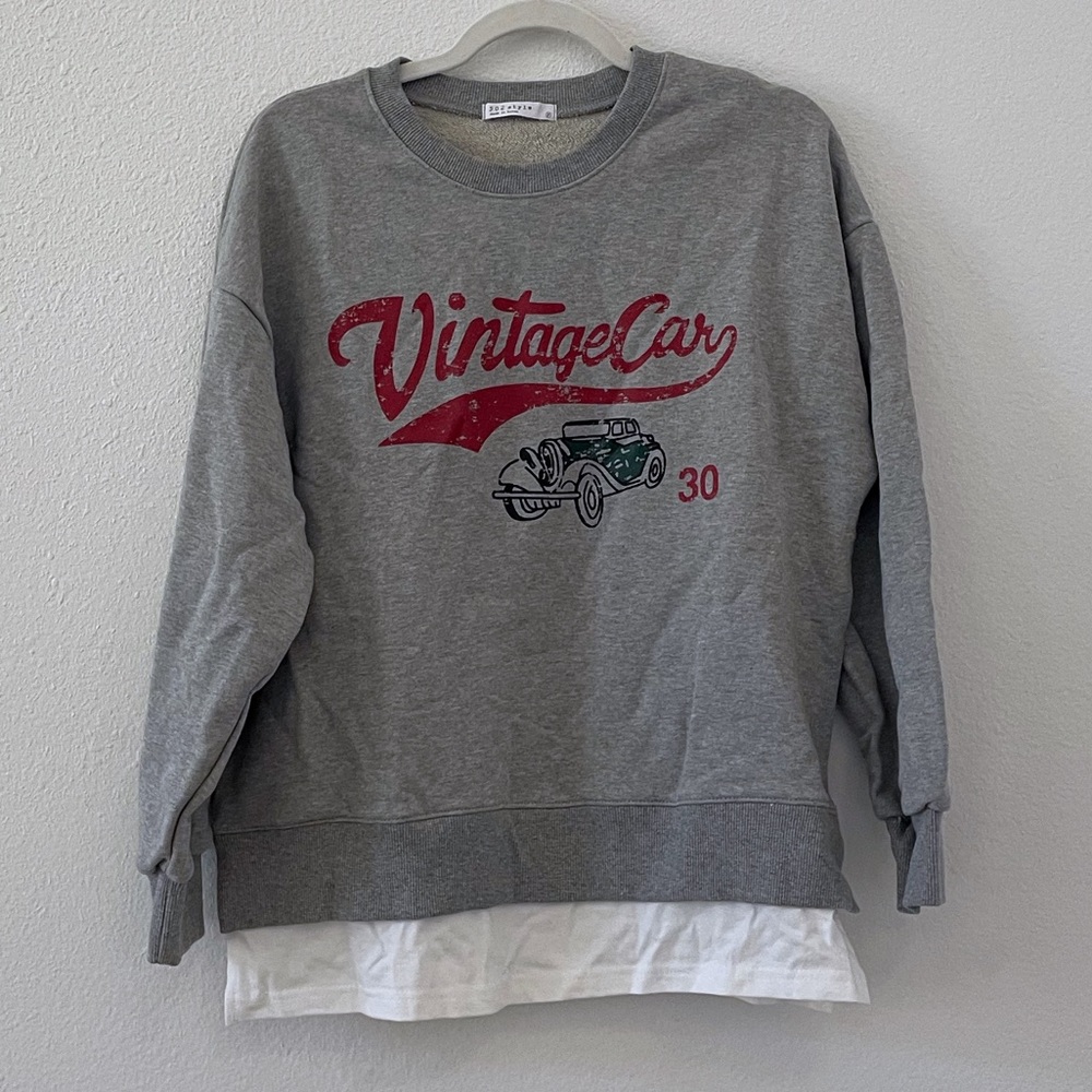 Vintage style grey graphic crewneck sweatshirt with attached inner shirt look